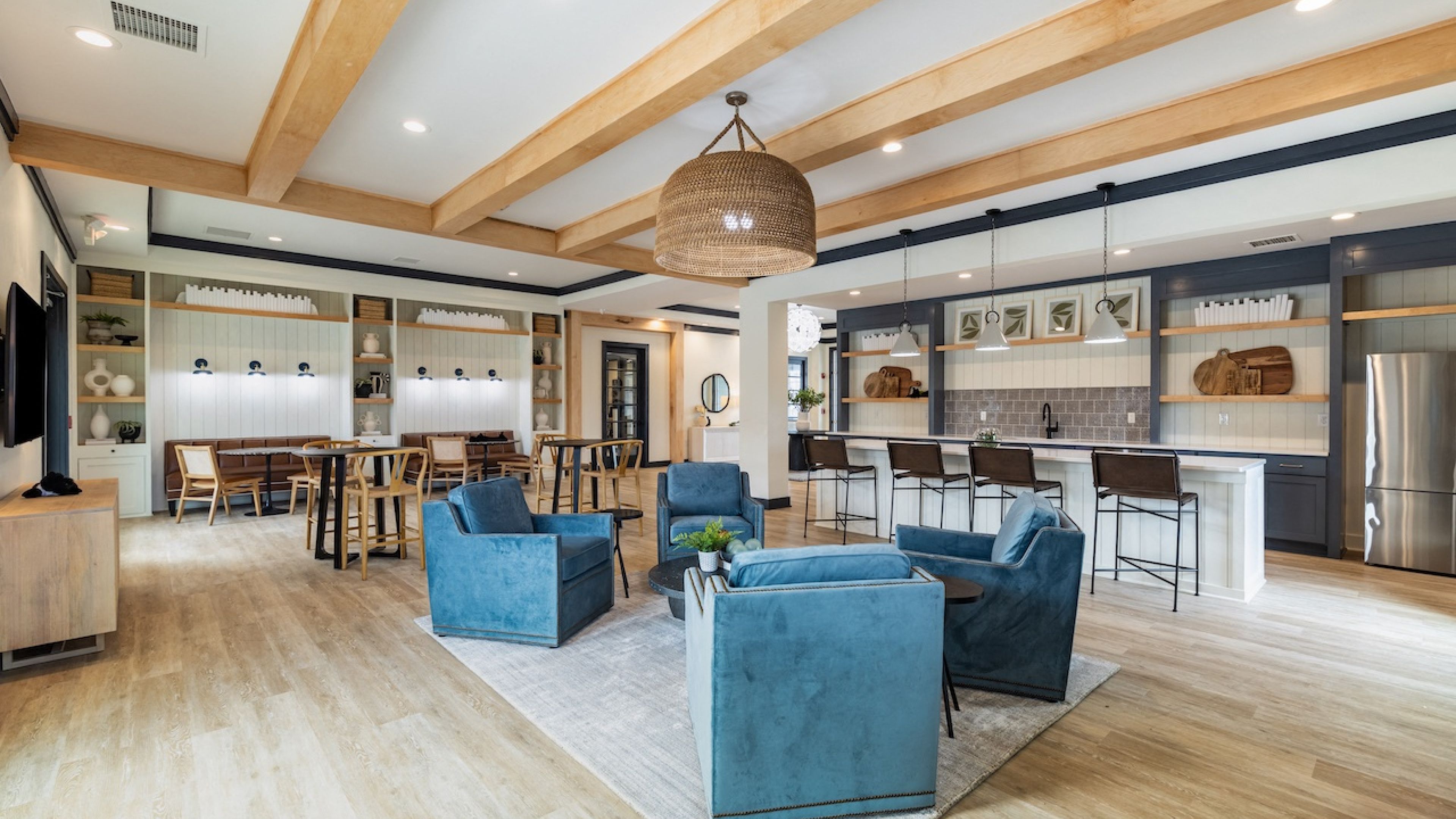 Hawthorne at Stillwater beautiful resident clubhouse amenity with seating and an entertainment space with kitchen